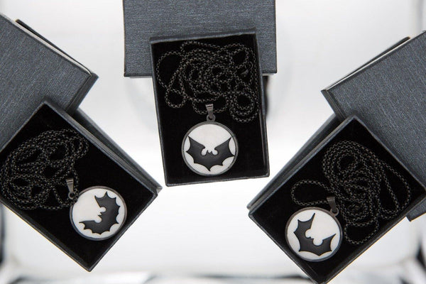black bat logo necklaces in three gift boxes